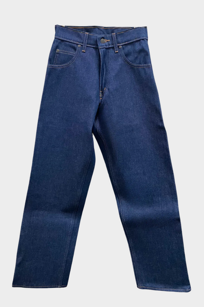 A pair of hanging blue work jeans with flat front, two front pockets and a coin pocket. Standard button and zipper closure and belt loops.