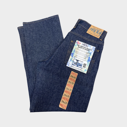 Relaxed fit denim jeans shown in blue. 5-pockets total, including 2 front pockets, 2 back pockets, and 1 coin pocket. No suspender buttons. 