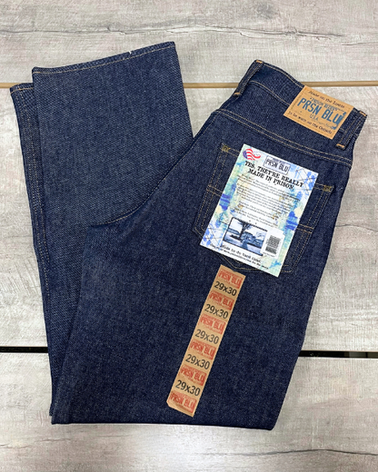 Relaxed fit denim jeans shown in blue. 5-pockets total, including 2 front pockets, 2 back pockets, and 1 coin pocket. No suspender buttons. 