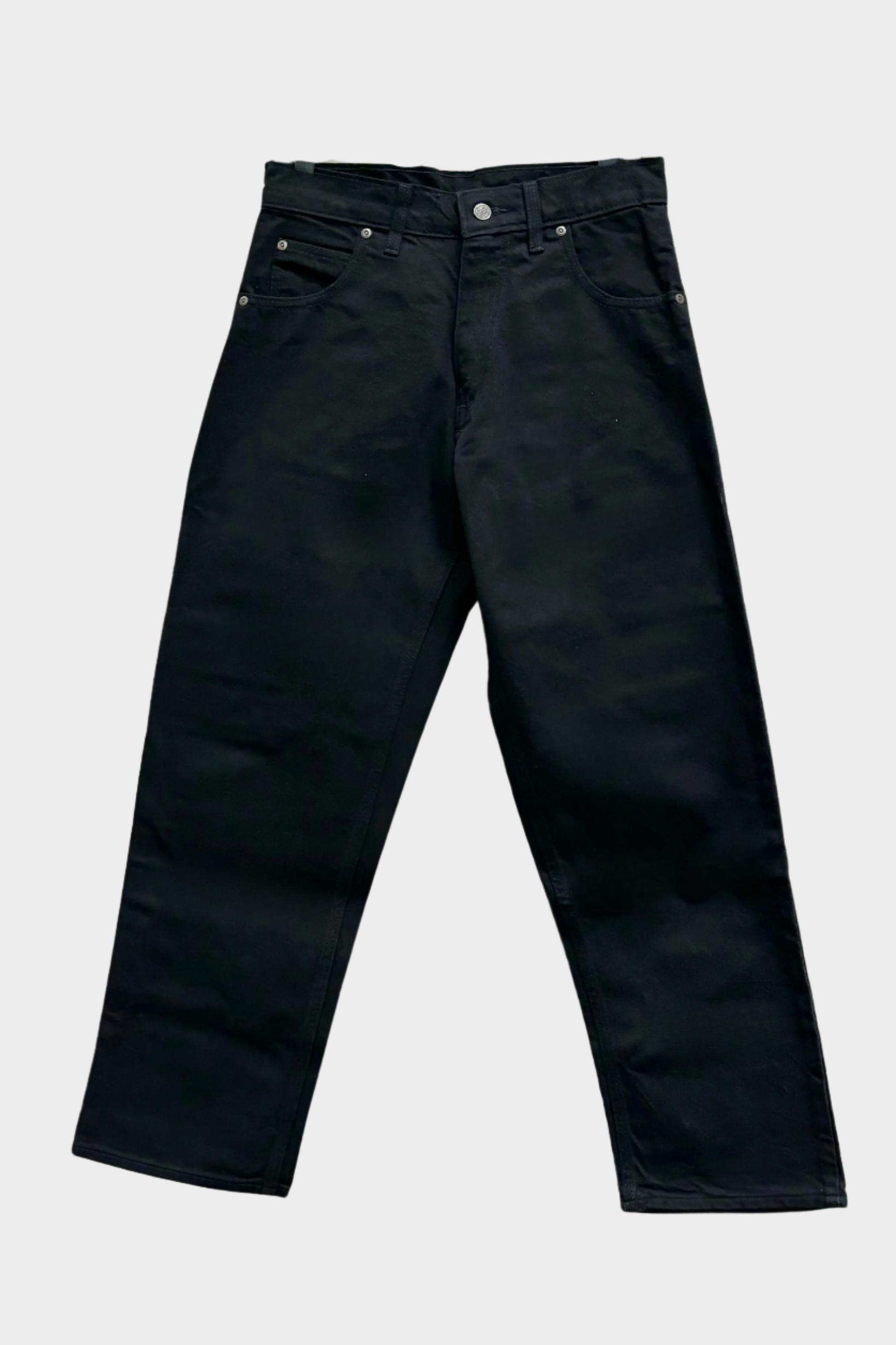 Black denim jeans with 5-pocket design, including 2 front pockets, 2 back pockets, and 1 coin pocket, and double-panel. No suspender buttons. Relaxed fit. 