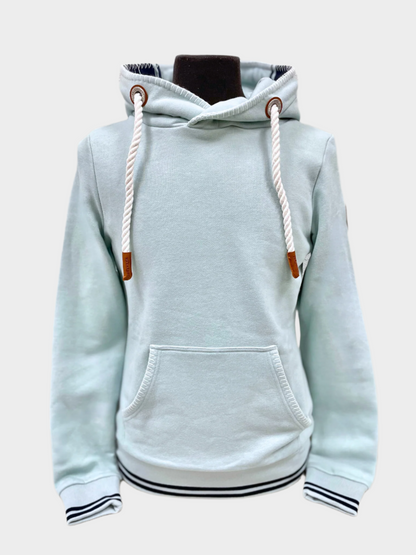 Womens pullover hoodie by Wanakome. Shown in a light blue. Blanket stitching on hood and front pocket.