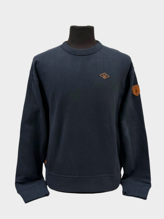 Mens midweight crew neck sweater. with left chest wanakome W embroidery and shoulder faux leather patch. Shown in dark navy