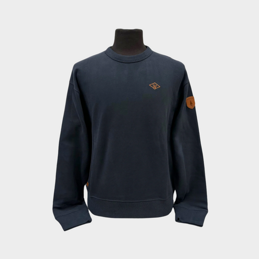 Mens midweight crew neck sweater. with left chest wanakome W embroidery and shoulder faux leather patch. Shown in dark navy