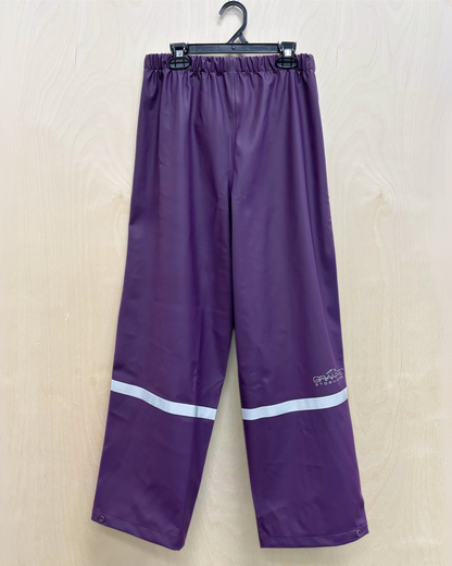 kids purple rain pants with reflective strip across ankles