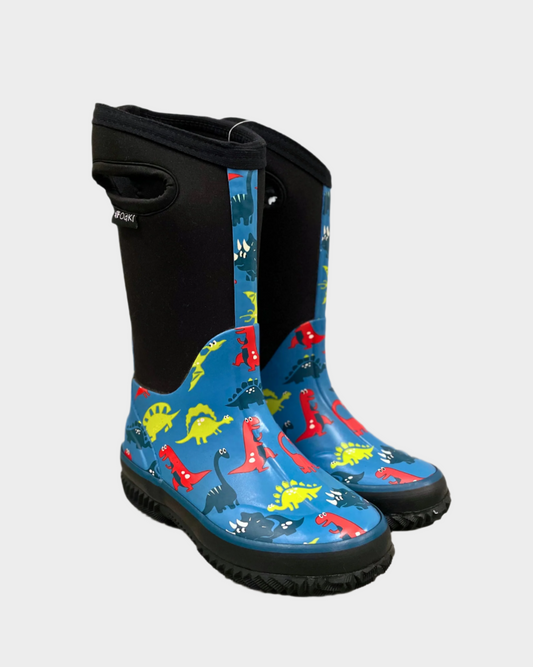 Kids neoprene boots with black neoprene upper and sides with handle cutouts and pulltab, Blues dinosaur pattern rubberized ankle and sole with seam detail. Black tread.