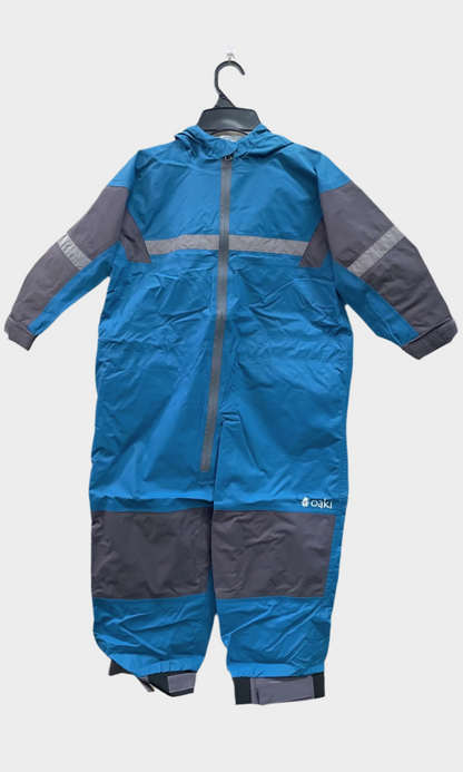 Kids rain suit with attached hood, grey color blocking on top of arms and across shins with safety reflective strips. Shown in celestial blue, a medium blue.