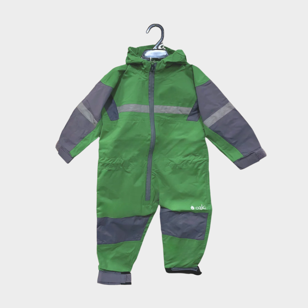 Kids rain suit with attached hood, grey color blocking on top of arms and across shins with safety reflective strips. Shown in dark green.