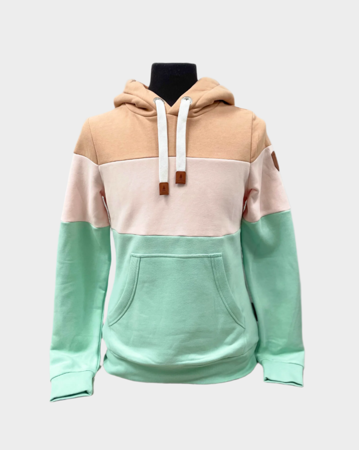 Womens Pullover hoodie with flat drawstrings and kangaroo pocket. Shown in color block, top in tan, middle in a light beige, and bottom third in a mint green. 