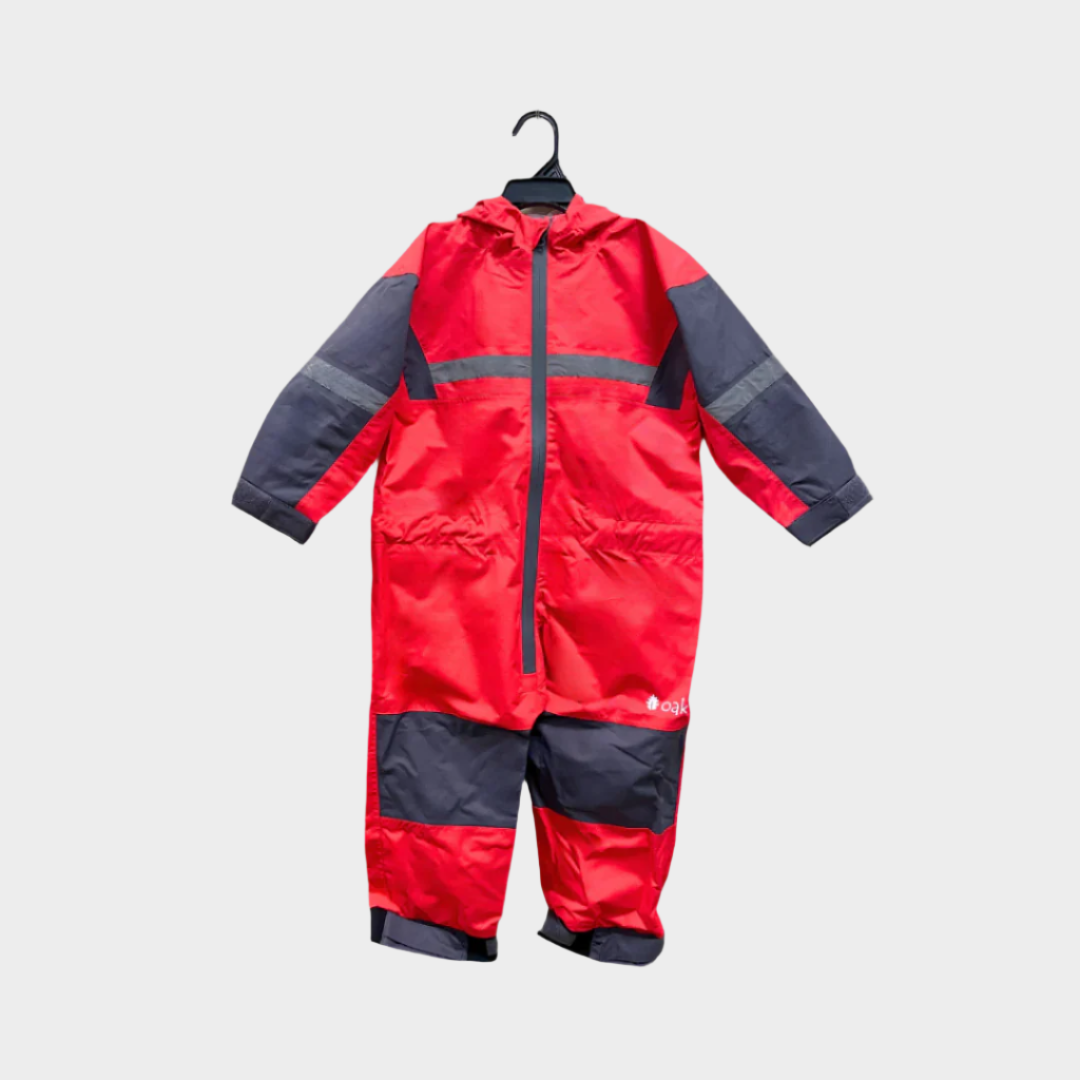 Kids rain suit with attached hood, grey color blocking on top of arms and across shins with safety reflective strips. Shown in fiery red.