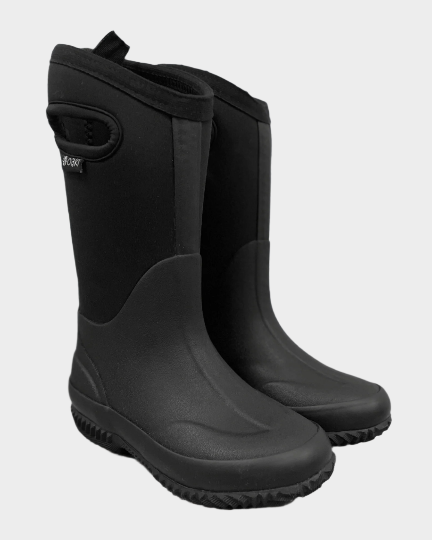 Kids neoprene boots with black neoprene upper and sides with handle cutouts and pulltab, black rubberized ankle and sole with seam detail. Black tread.