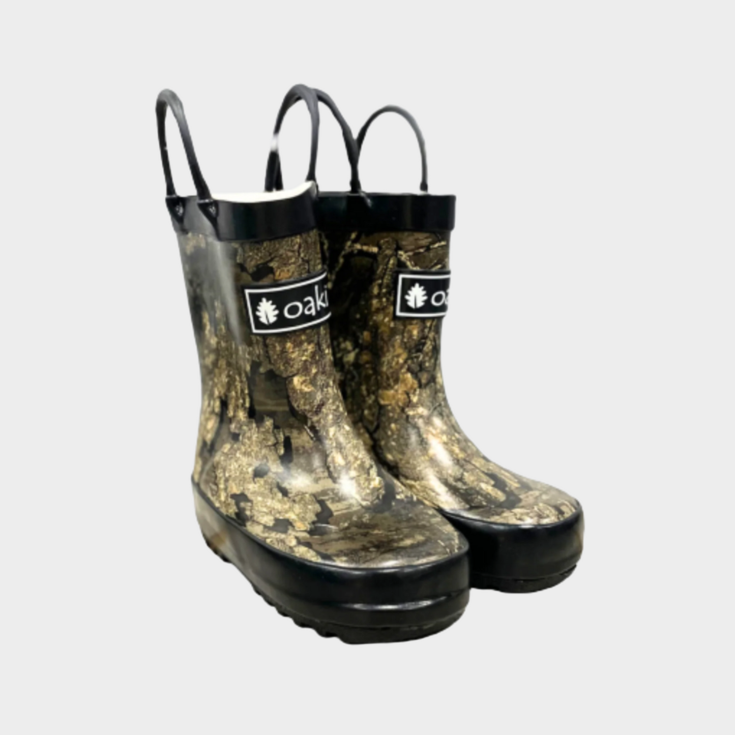 Kids rubber rain boots with tree bark camo rubber and oaki logo. Black tread and loop handles.