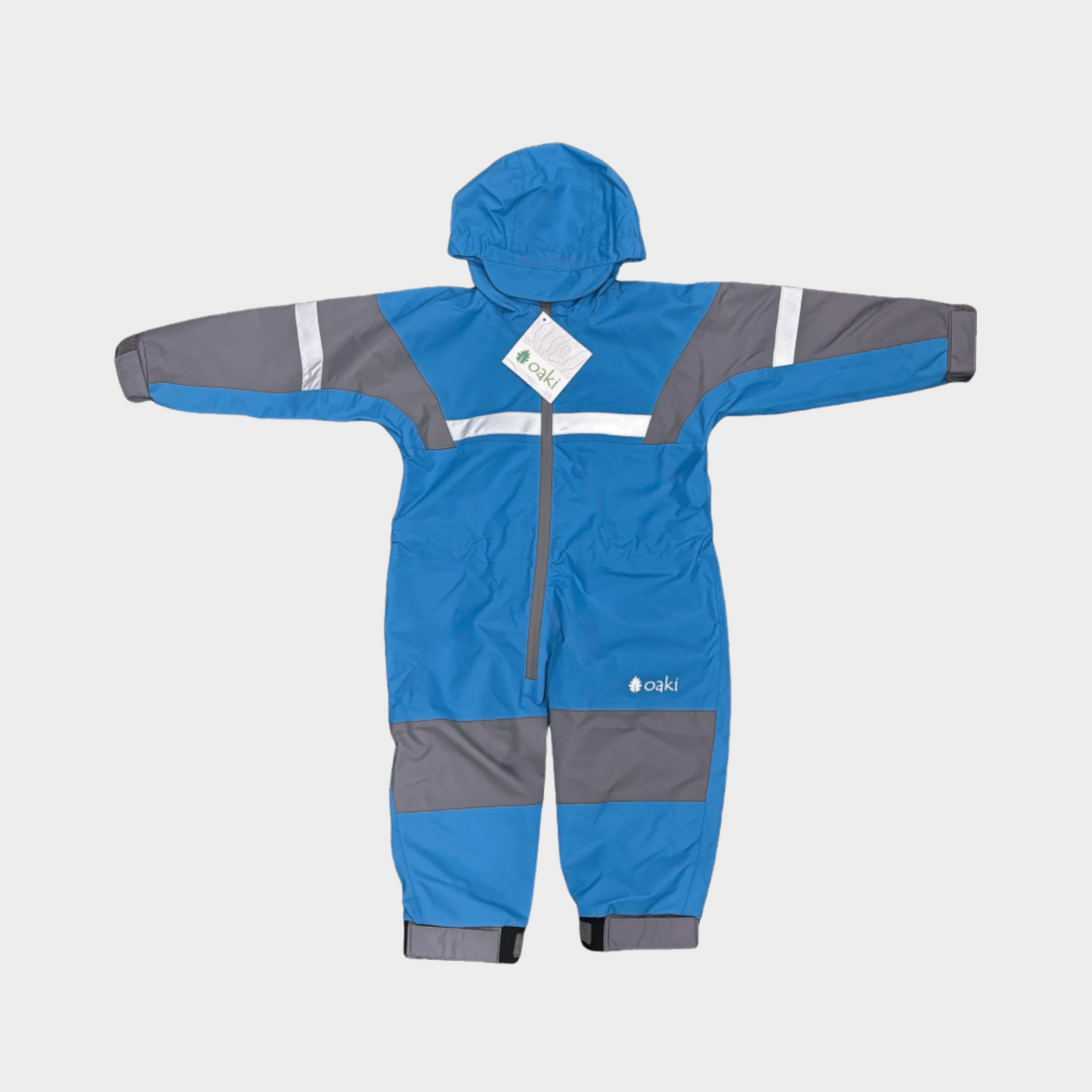 Kids rain suit with attached hood, grey color blocking on top of arms and across shins with safety reflective strips. Shown in celestial blue, a medium blue.