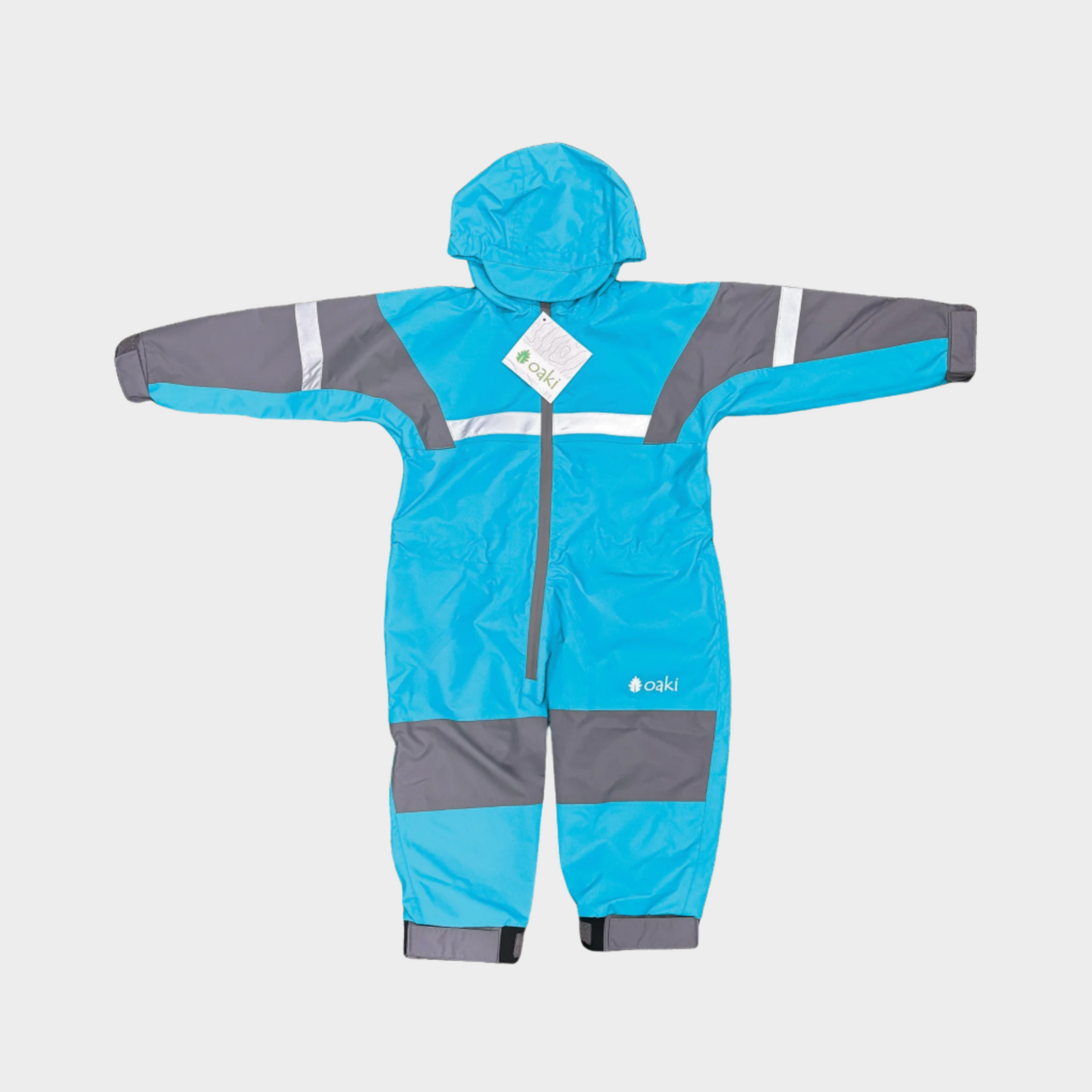 Kids rain suit with attached hood, grey color blocking on top of arms and across shins with safety reflective strips. Shown in a varient of celestial blue, a lighter brighter blue. 