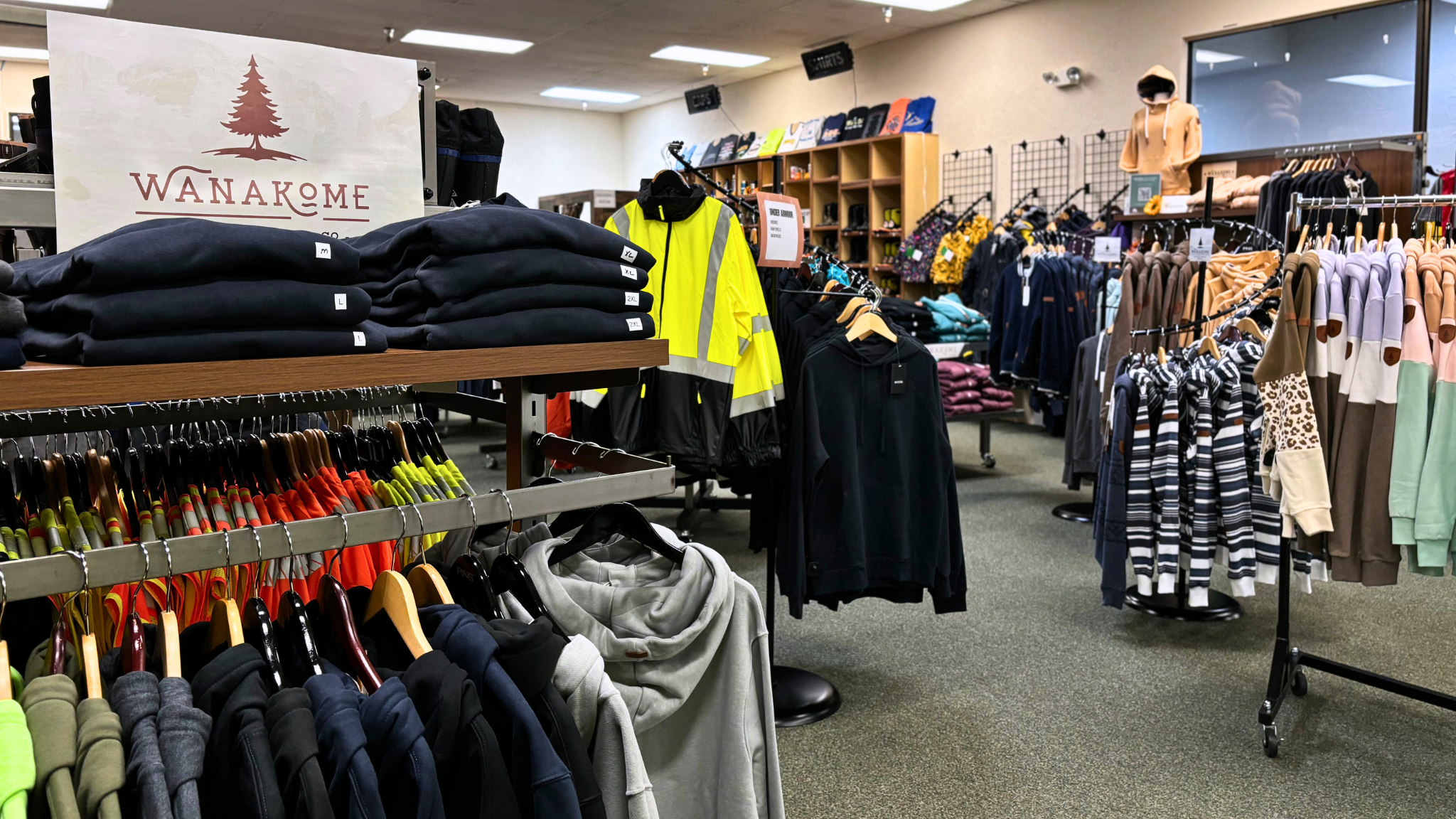 Store front with multiple clothing displays. 