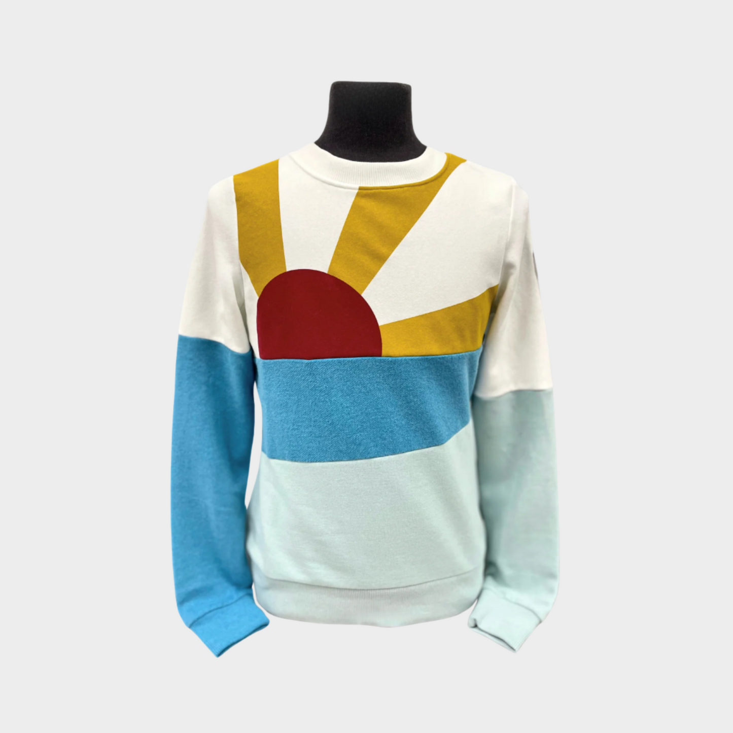 womens pullover crew neck sweater with red, yellow, dark and light blue sunset. 