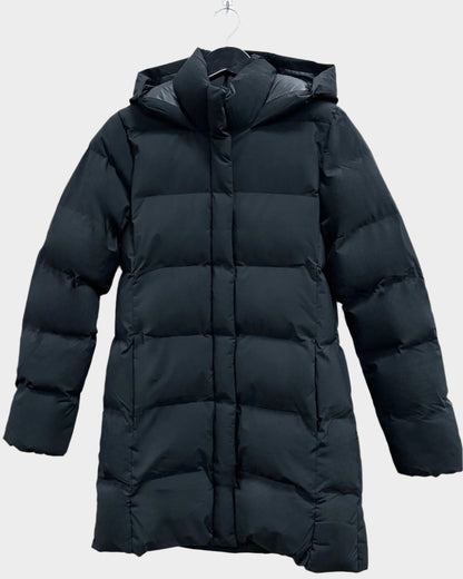 Womens winter parka. Front is quilted with puffs insulation, also hand pockets. Sleeves and back are also quilted. Neck has a puffy chin warmer connected to the zipper. Hood is also quilted. 